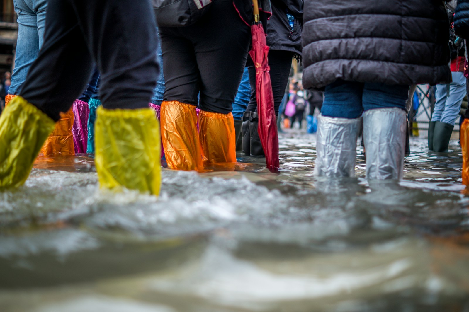 people with flood insurance wearing boots